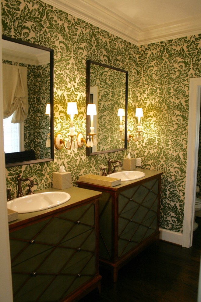 Example of a huge eclectic dark wood floor powder room design in DC Metro with furniture-like cabinets, medium tone wood cabinets, a two-piece toilet, green walls, a drop-in sink and wood countertops