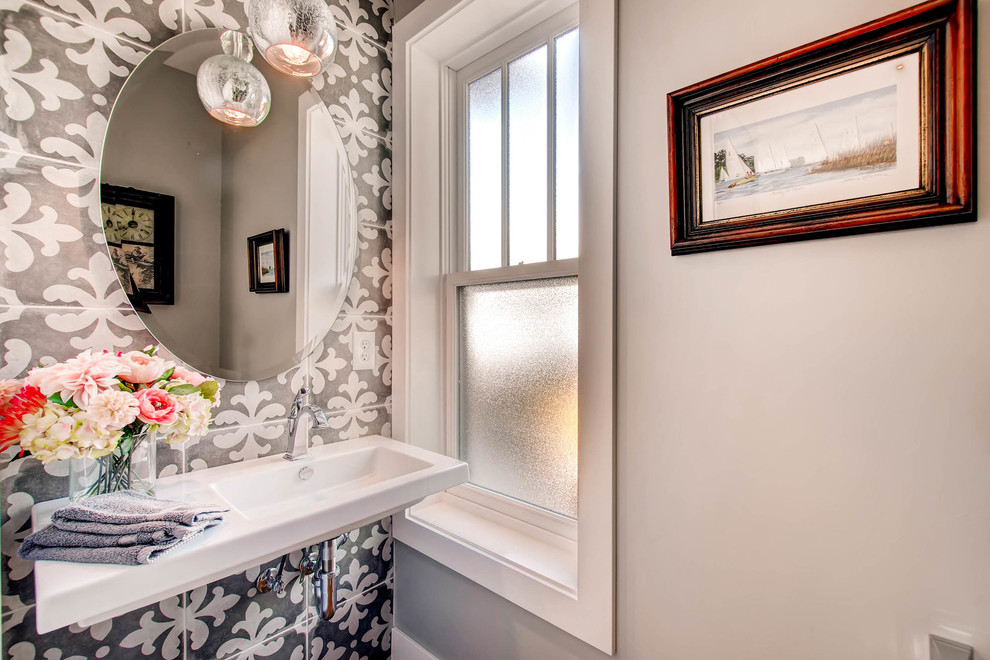 Powder room - small transitional powder room idea in Orange County with green walls and a wall-mount sink