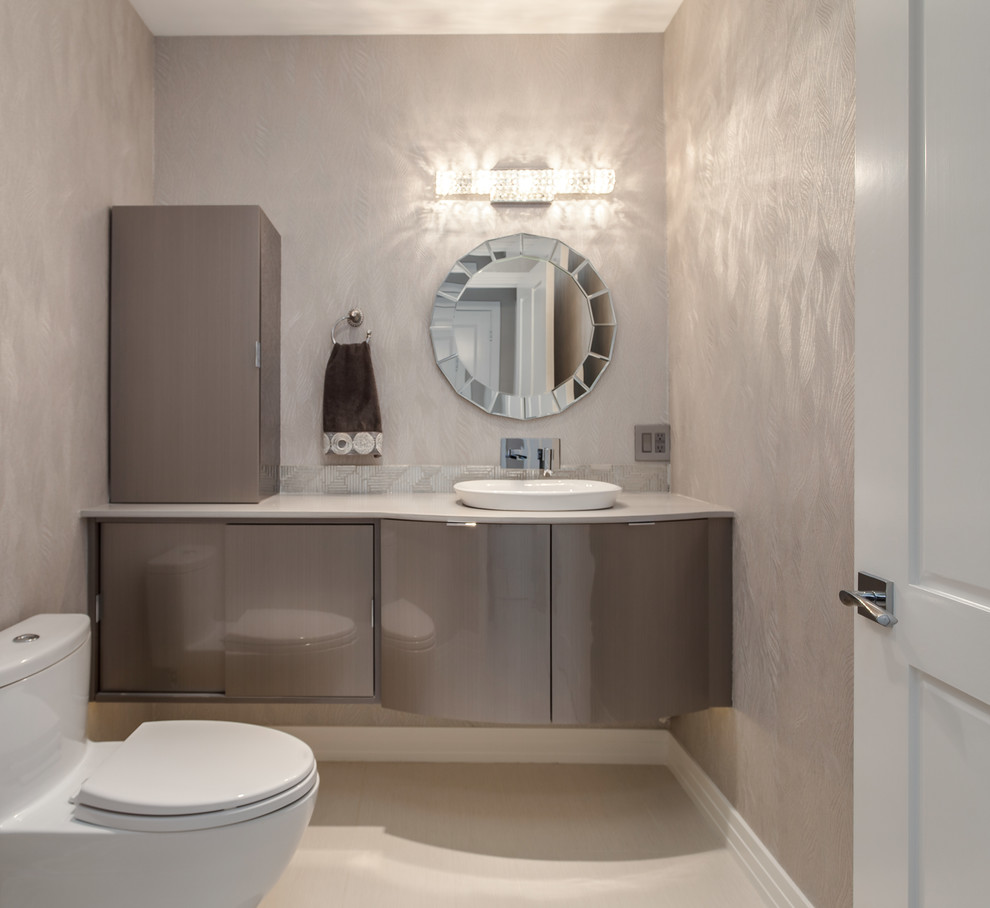 Mid-sized trendy white tile and porcelain tile porcelain tile powder room photo in Denver with a vessel sink, flat-panel cabinets, gray cabinets, quartz countertops, a one-piece toilet and gray walls