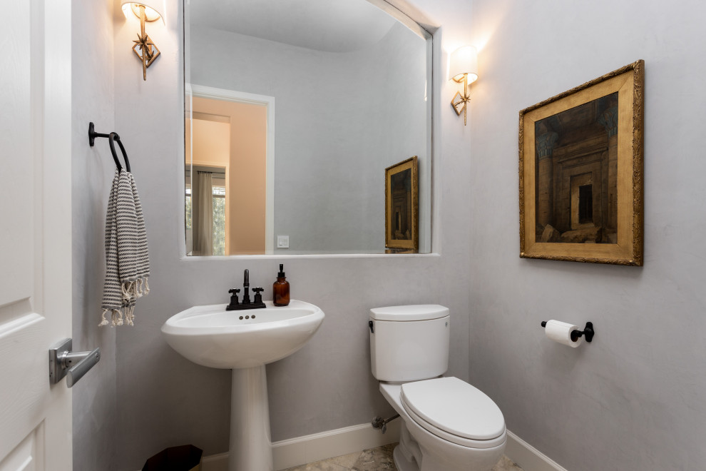 Trendy gray floor powder room photo in Phoenix with a two-piece toilet, gray walls and a pedestal sink