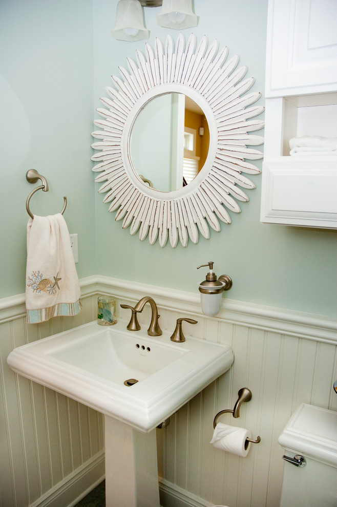 Beach style powder room photo in New York with a pedestal sink