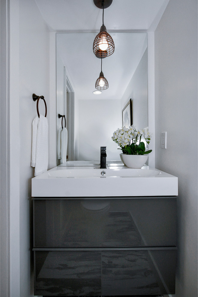 Design ideas for an urban cloakroom in Los Angeles with flat-panel cabinets and grey cabinets.