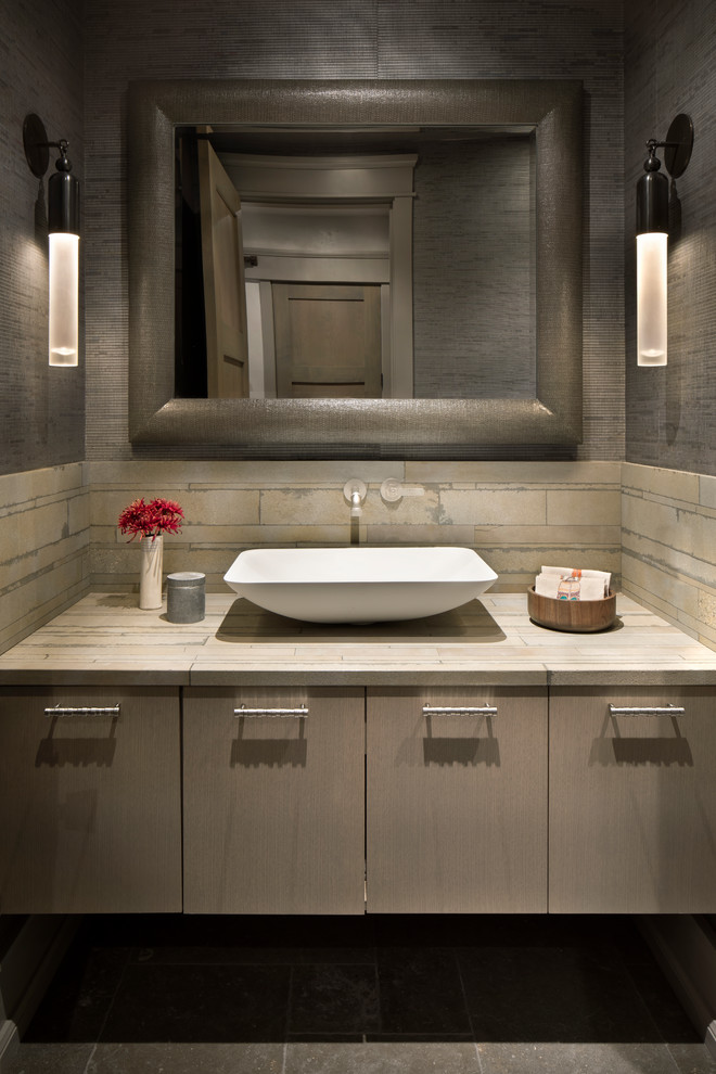 Inspiration for a rustic cloakroom in New York with flat-panel cabinets, brown cabinets, beige tiles, brown walls, a vessel sink and beige worktops.