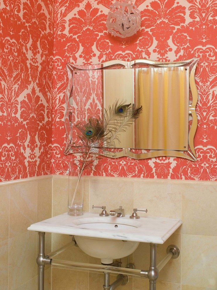 Ornate beige tile powder room photo in New York with a console sink, multicolored walls and white countertops