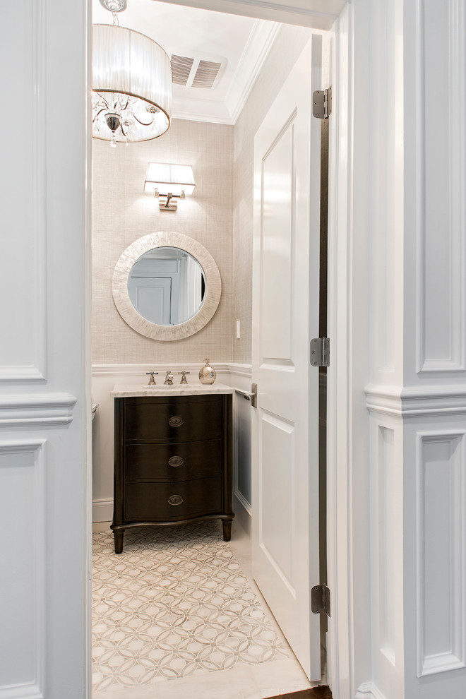 Photo of a traditional cloakroom in New York with a one-piece toilet, beige walls and freestanding cabinets.