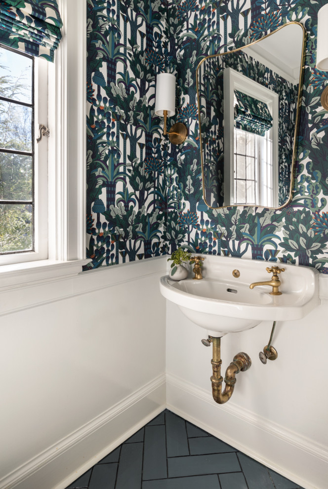 This is an example of a small traditional cloakroom in New York with porcelain flooring, green floors, multi-coloured walls and a wall-mounted sink.