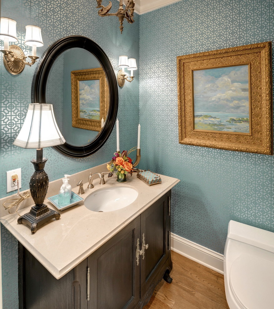 Inspiration for a timeless powder room remodel in Minneapolis with an undermount sink, recessed-panel cabinets and dark wood cabinets