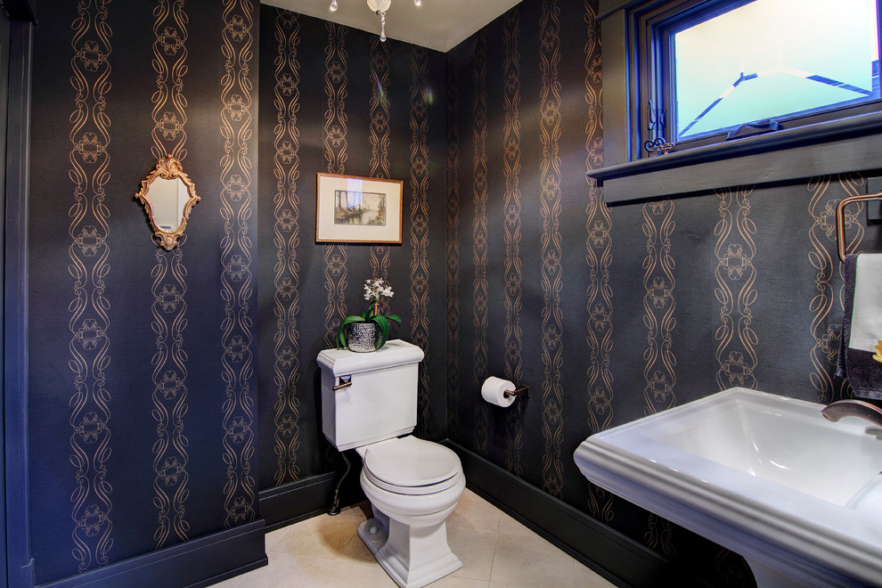 Photo of a large classic cloakroom in Calgary with a pedestal sink, a two-piece toilet, beige tiles, black walls and porcelain flooring.