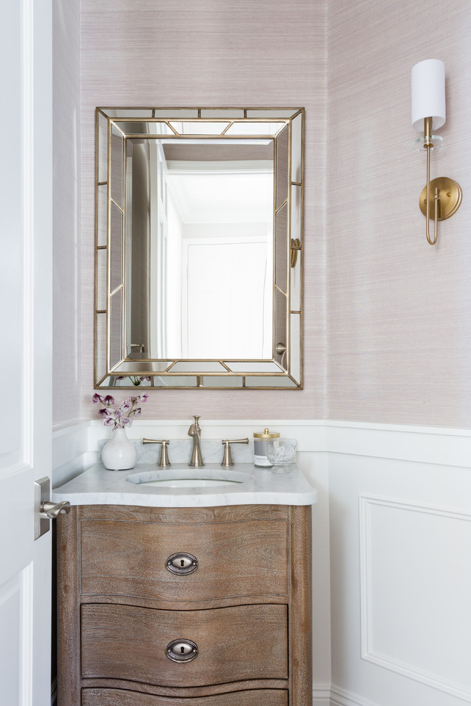 Small transitional beige tile powder room photo in Los Angeles with furniture-like cabinets, dark wood cabinets, beige walls, an undermount sink and marble countertops