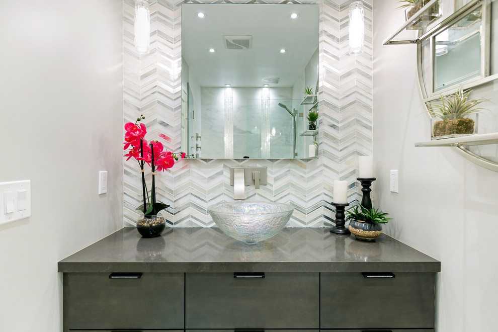 Photo of a small traditional cloakroom in San Diego with flat-panel cabinets, grey cabinets, a one-piece toilet, grey tiles, marble tiles, grey walls, marble flooring, a vessel sink, engineered stone worktops and grey floors.