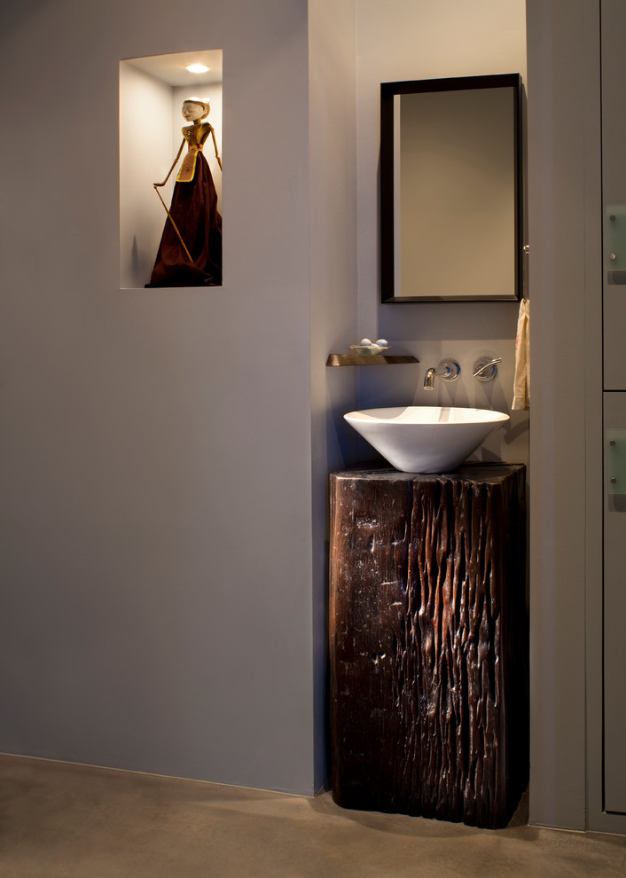 Contemporary cloakroom in Other with a vessel sink.