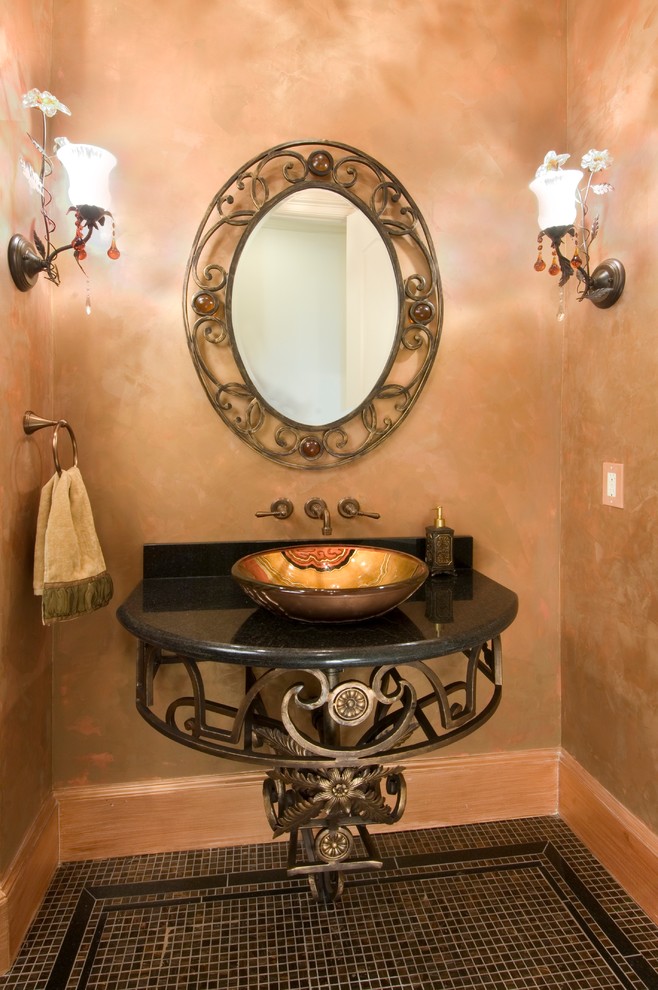Example of a tuscan powder room design in Houston
