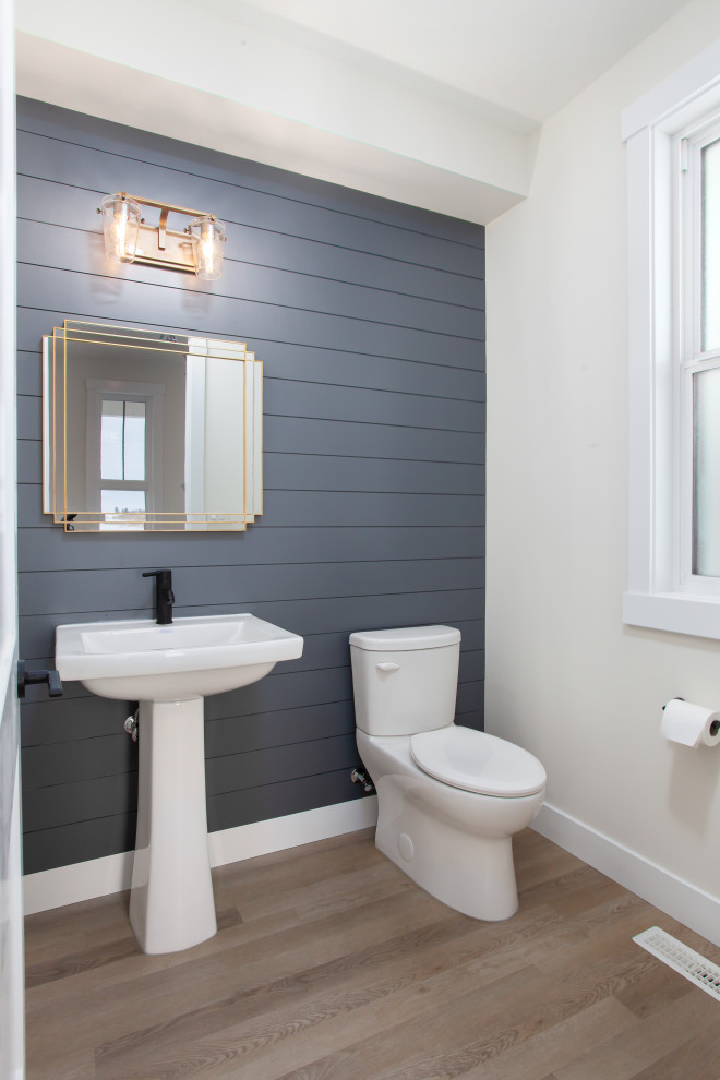 Design ideas for a medium sized farmhouse cloakroom in Edmonton with a two-piece toilet, grey tiles, grey walls, vinyl flooring, a pedestal sink and beige floors.