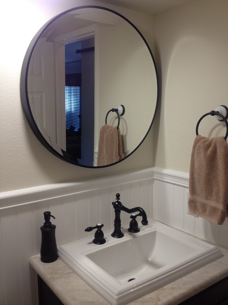 Small country powder room photo in Orange County with a one-piece toilet, beige walls, a drop-in sink and quartzite countertops