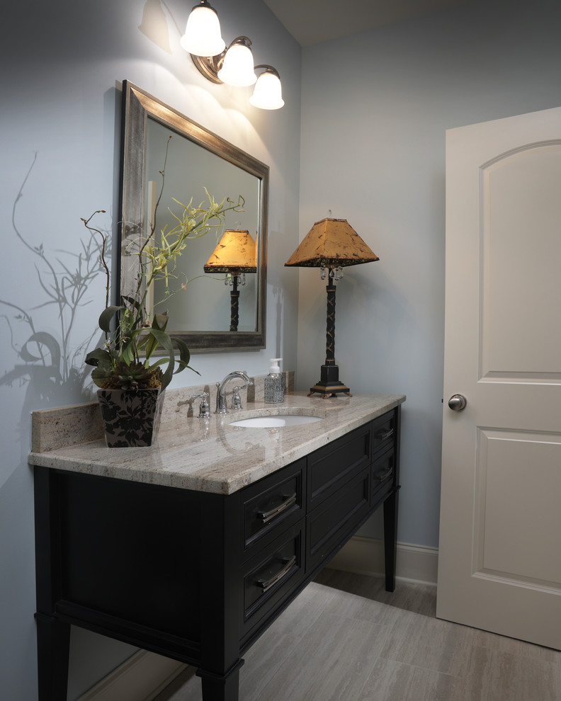Inspiration for a mid-sized timeless vinyl floor powder room remodel in Atlanta with furniture-like cabinets, black cabinets, a two-piece toilet, gray walls, an undermount sink, quartzite countertops and beige countertops