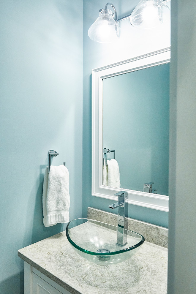 Example of a trendy powder room design in Other with white cabinets, blue walls, a vessel sink and gray countertops
