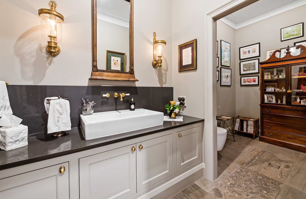 Example of a classic powder room design in Other