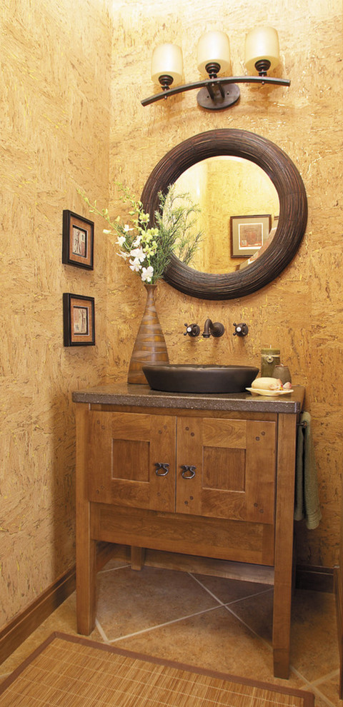 На фото: туалет среднего размера в стиле рустика с фасадами в стиле шейкер, фасадами цвета дерева среднего тона, коричневыми стенами, полом из керамической плитки, накладной раковиной и коричневым полом с