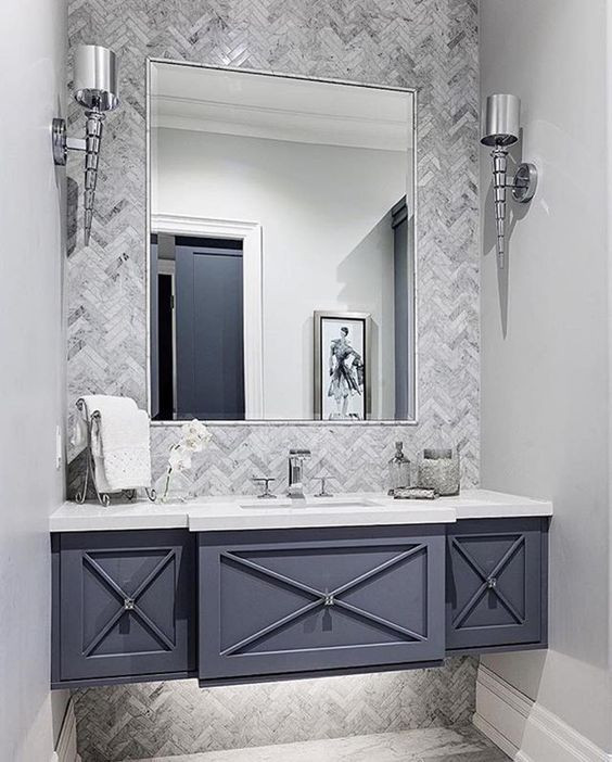 Design ideas for a medium sized modern cloakroom in Phoenix with freestanding cabinets, blue cabinets, grey tiles, marble tiles, grey walls, a submerged sink, engineered stone worktops and white worktops.