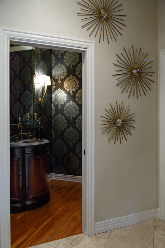 Inspiration for a small transitional powder room remodel in Milwaukee with an undermount sink, furniture-like cabinets, dark wood cabinets and multicolored walls