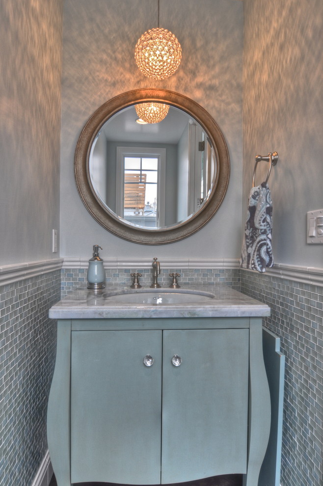 This is an example of a traditional cloakroom in Los Angeles with marble worktops and a dado rail.