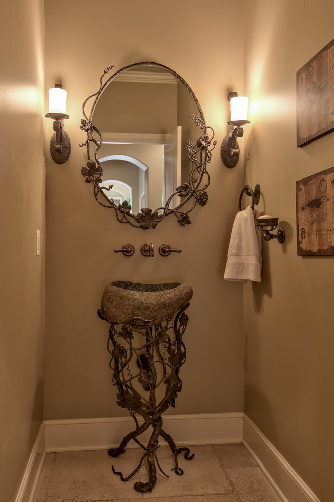 Example of a tuscan powder room design in Omaha