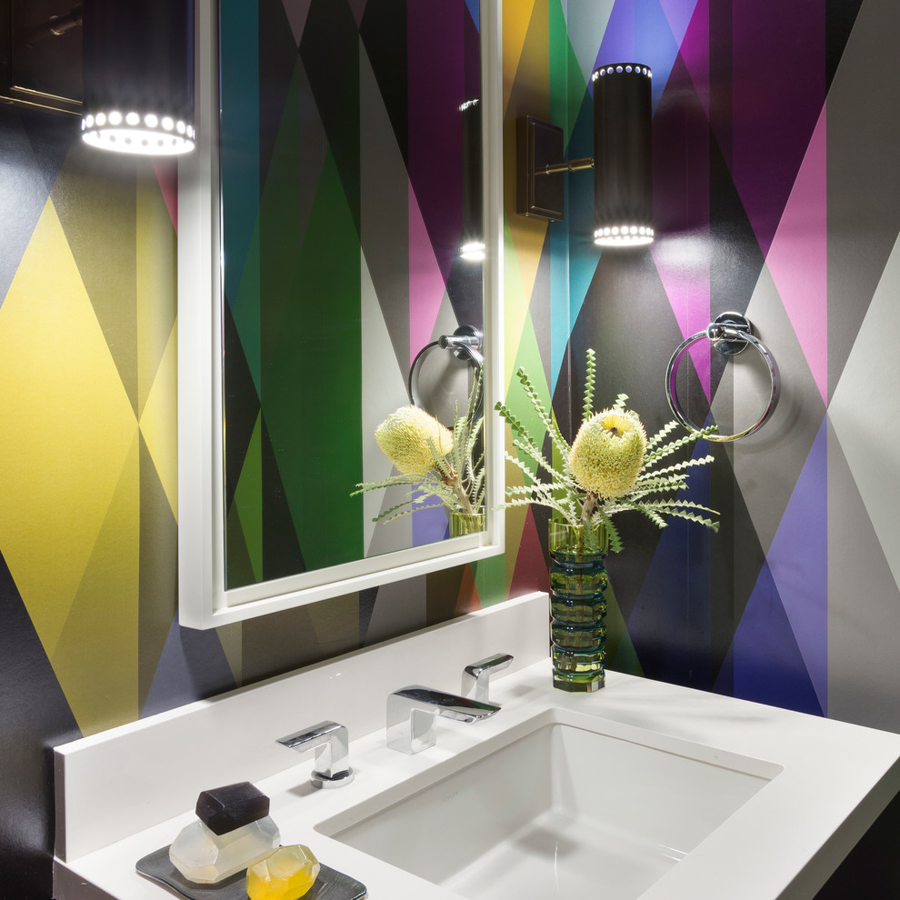 Trendy powder room photo in Los Angeles with an undermount sink, multicolored walls and white countertops