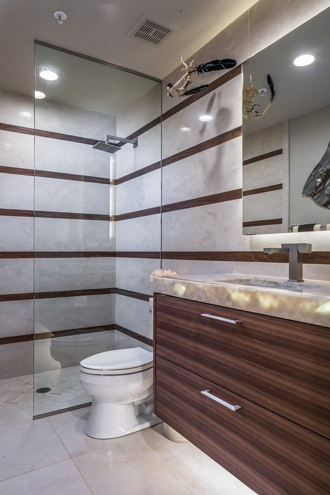 This is an example of a small contemporary cloakroom in Phoenix with flat-panel cabinets, dark wood cabinets, beige tiles, porcelain tiles, porcelain flooring, a submerged sink, quartz worktops, beige floors and multi-coloured worktops.