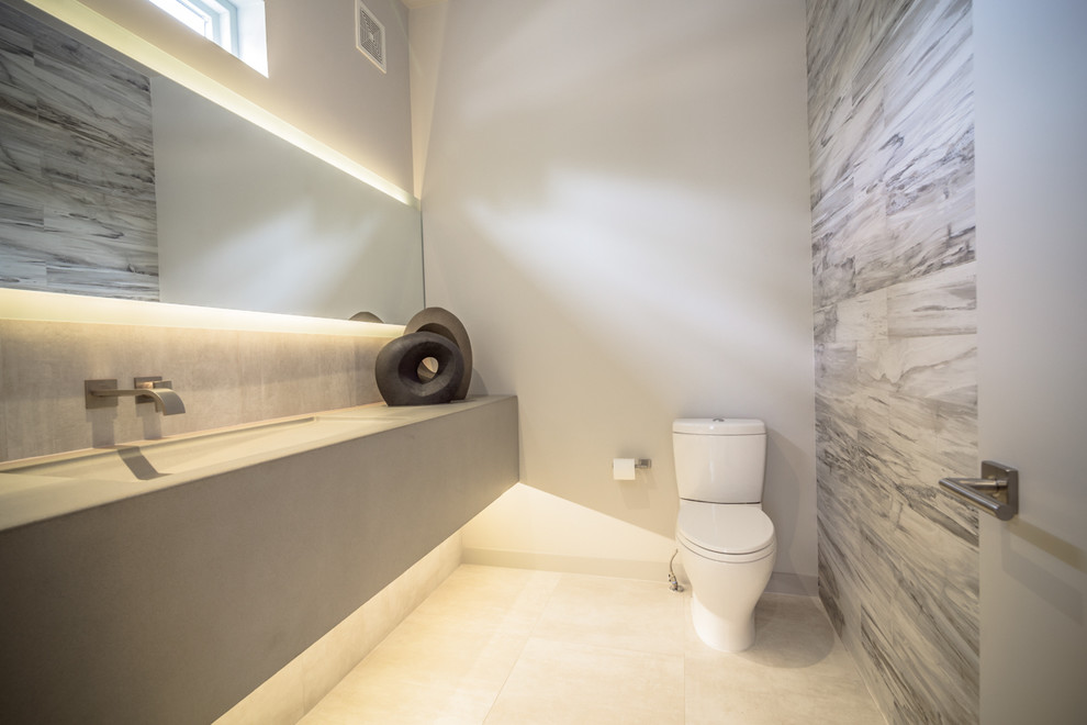 Mid-sized minimalist powder room photo in Denver with an integrated sink, concrete countertops and a two-piece toilet