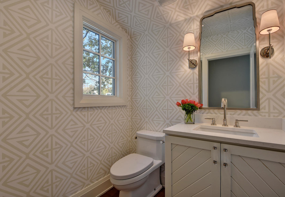 Small transitional powder room photo in Austin with furniture-like cabinets, white cabinets, a one-piece toilet, an undermount sink and quartz countertops
