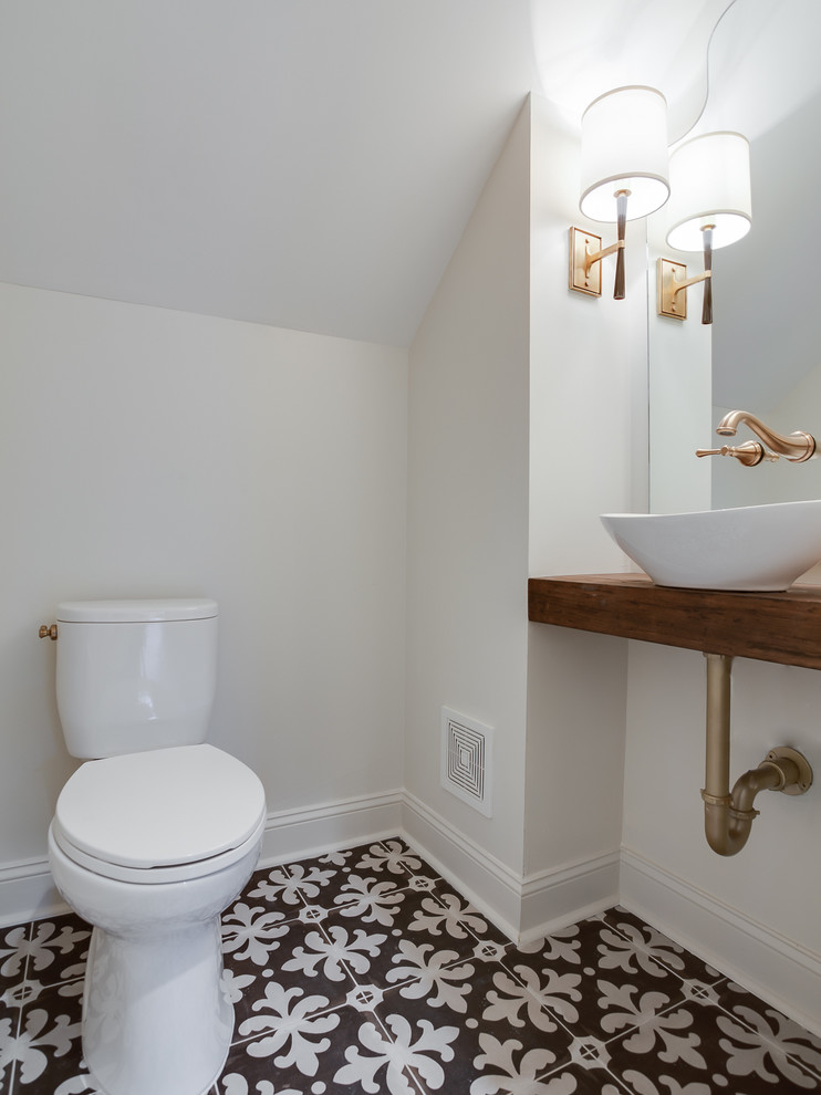 Small transitional powder room photo in Other with a two-piece toilet, white walls, a vessel sink, wood countertops and brown countertops