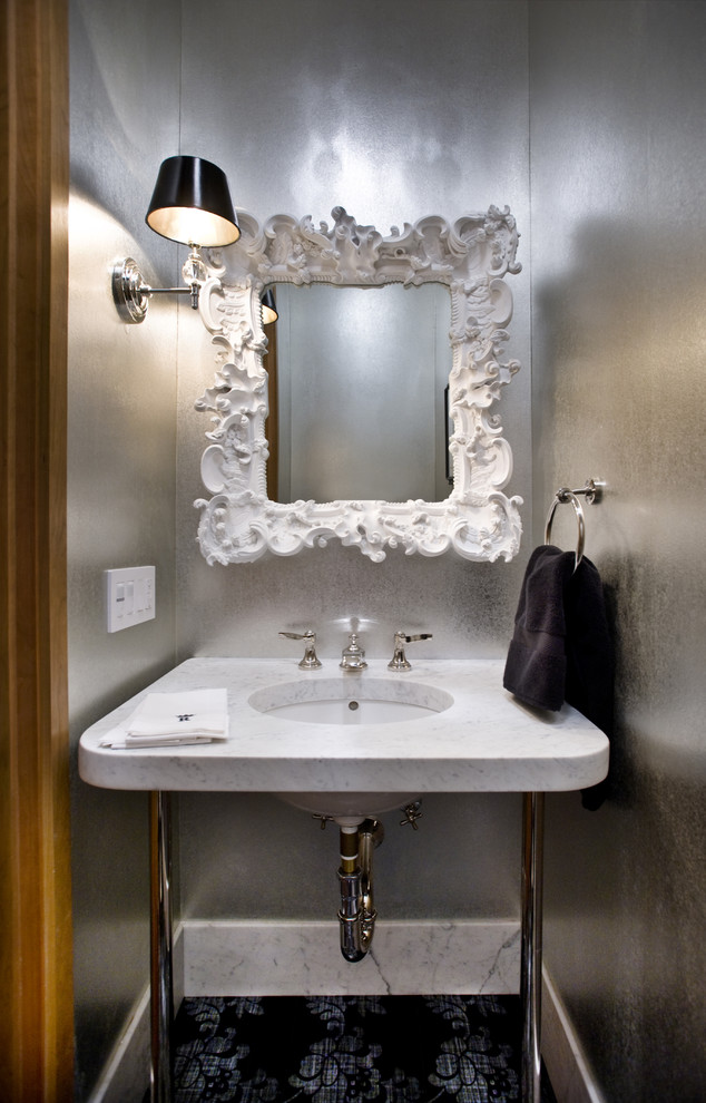 Ejemplo de aseo contemporáneo con lavabo tipo consola y paredes grises