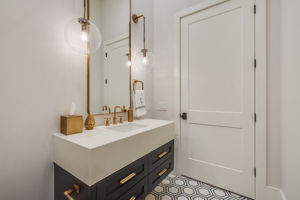 Inspiration for a mid-sized transitional multicolored floor powder room remodel with shaker cabinets, black cabinets, a one-piece toilet, white walls, an undermount sink, quartz countertops and white countertops