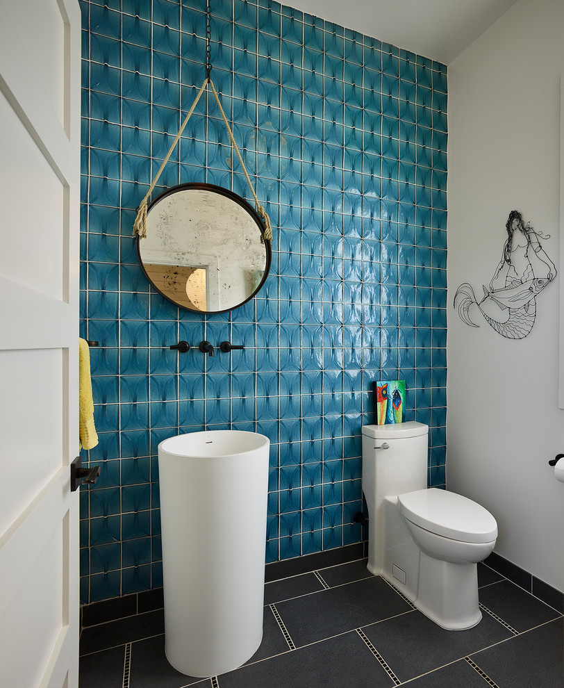 Inspiration for a small coastal blue tile and glass tile gray floor powder room remodel in San Francisco with a one-piece toilet, blue walls, a pedestal sink and white cabinets