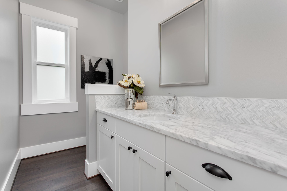 Design ideas for a large classic cloakroom in Seattle with shaker cabinets, white cabinets, grey tiles, grey walls, a submerged sink, marble worktops and white worktops.