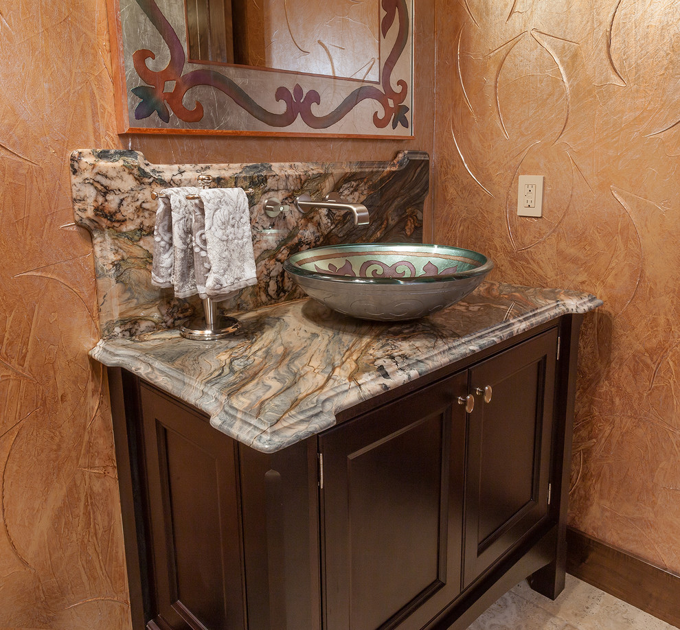 This is an example of a medium sized rustic cloakroom in Denver with recessed-panel cabinets, dark wood cabinets, a vessel sink and granite worktops.