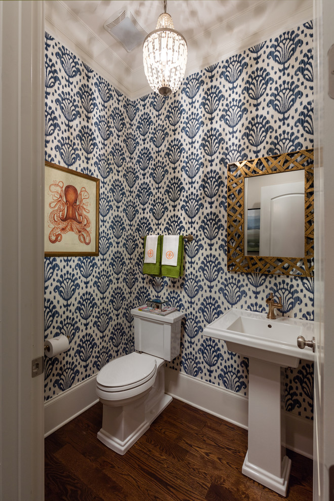 Inspiration for a small transitional dark wood floor and brown floor powder room remodel in Atlanta with blue walls, a pedestal sink and a two-piece toilet