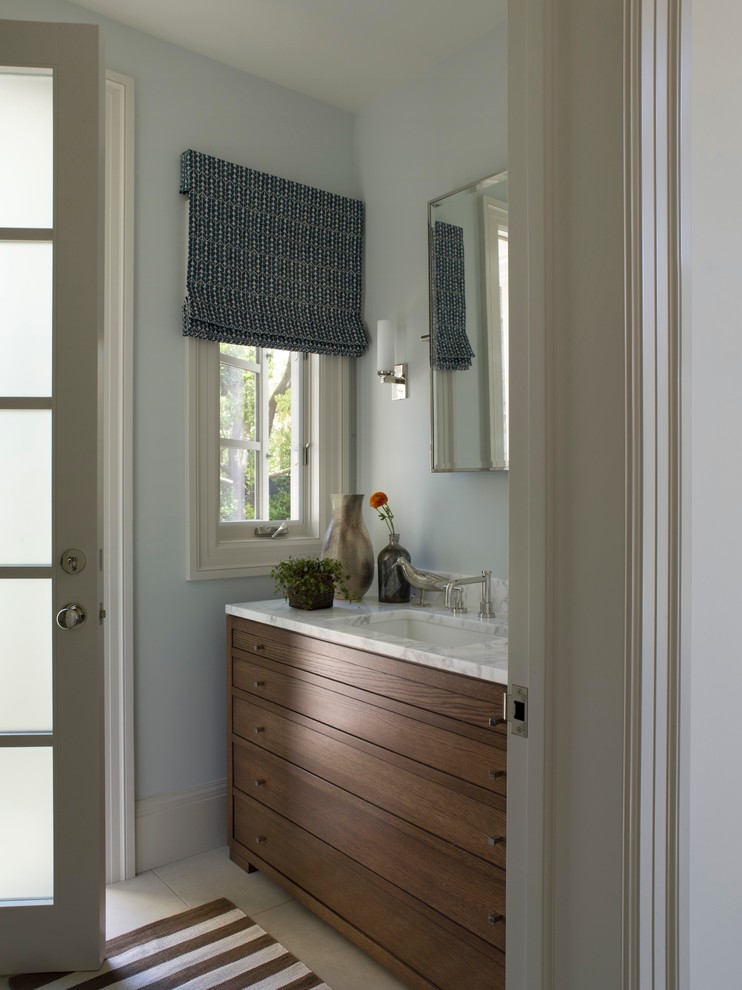 Traditional cloakroom in San Francisco with a submerged sink, flat-panel cabinets and medium wood cabinets.