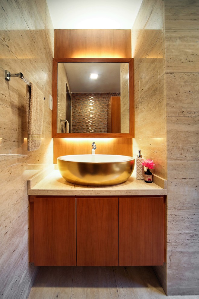 Ispirazione per un bagno di servizio minimal con lavabo a bacinella, ante lisce e ante in legno scuro