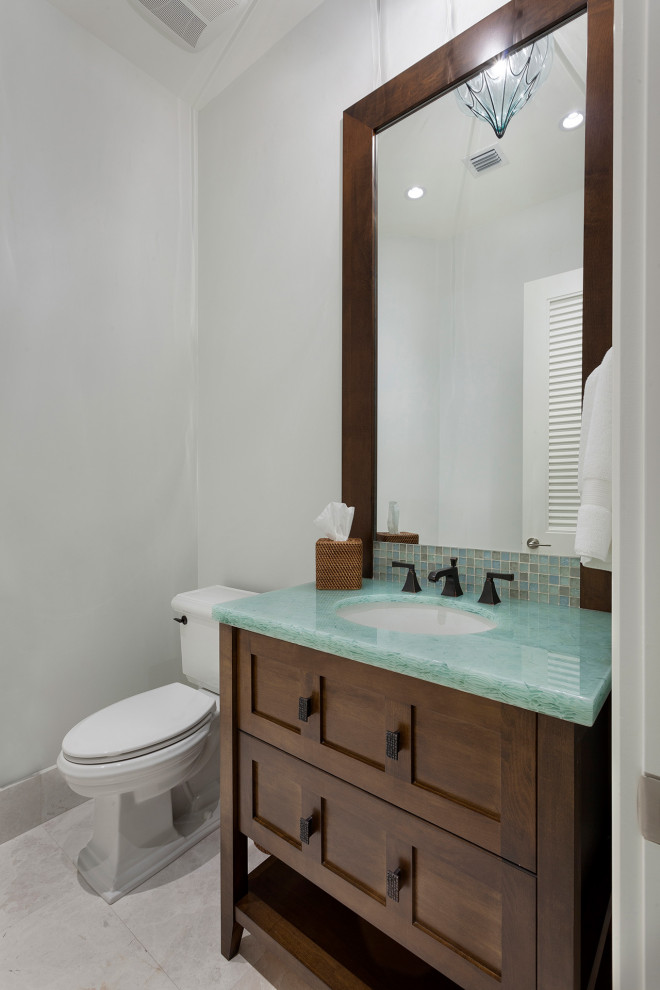 Medium sized cloakroom in Miami with shaker cabinets, medium wood cabinets, a one-piece toilet, grey tiles, marble tiles, grey walls, porcelain flooring, a submerged sink, laminate worktops, grey floors and white worktops.