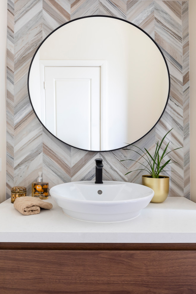 Inspiration for a small contemporary multicolored tile and marble tile medium tone wood floor and brown floor powder room remodel in Brisbane with flat-panel cabinets, medium tone wood cabinets, a one-piece toilet, multicolored walls, a vessel sink, quartz countertops and white countertops