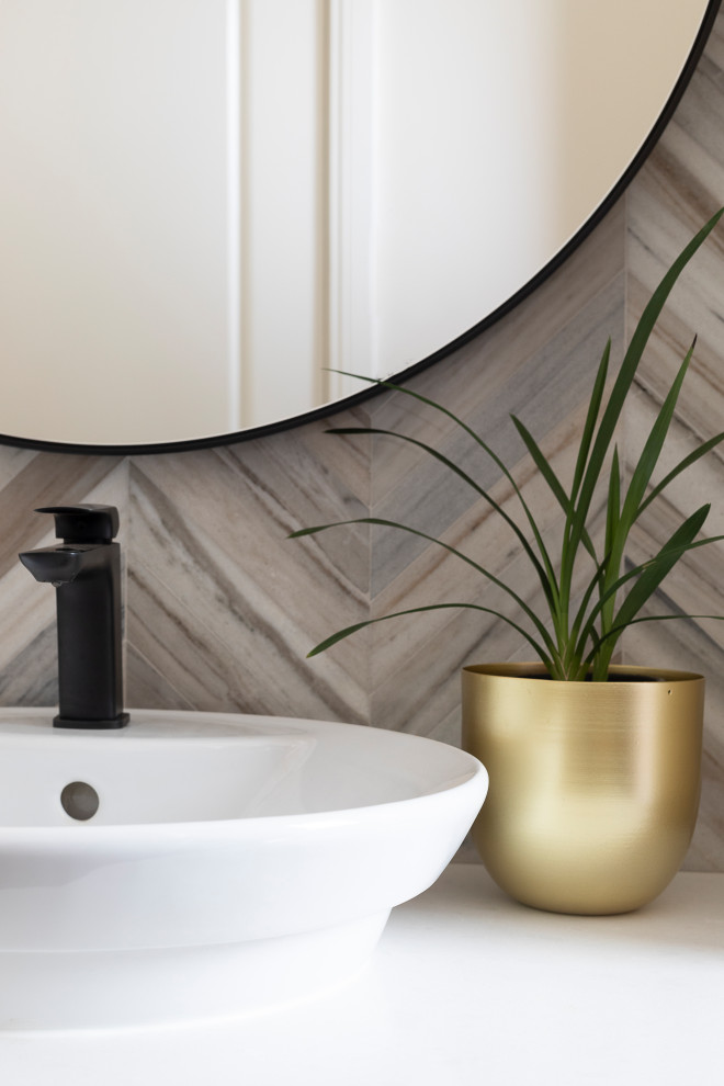 Inspiration for a small cloakroom in Brisbane with flat-panel cabinets, medium wood cabinets, a one-piece toilet, multi-coloured tiles, marble tiles, multi-coloured walls, medium hardwood flooring, a vessel sink, engineered stone worktops, brown floors and white worktops.