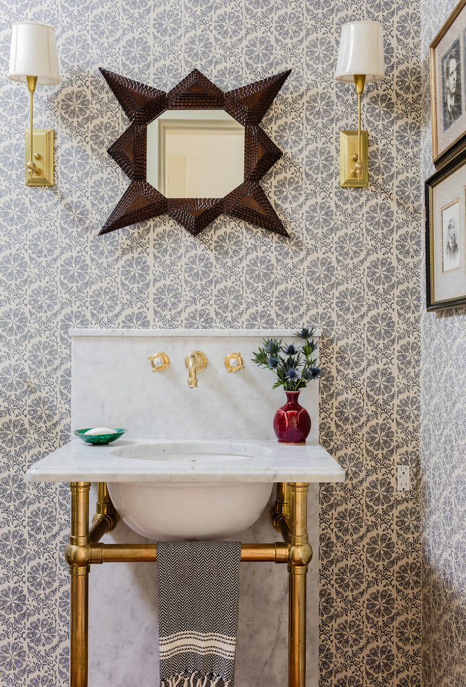 Transitional powder room photo in Boston with multicolored walls and a console sink