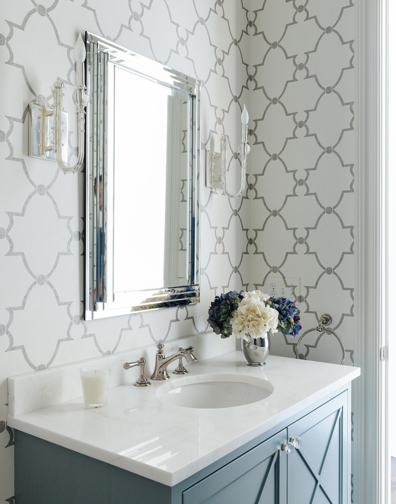 Example of a transitional powder room design in Charlotte with multicolored walls and an undermount sink
