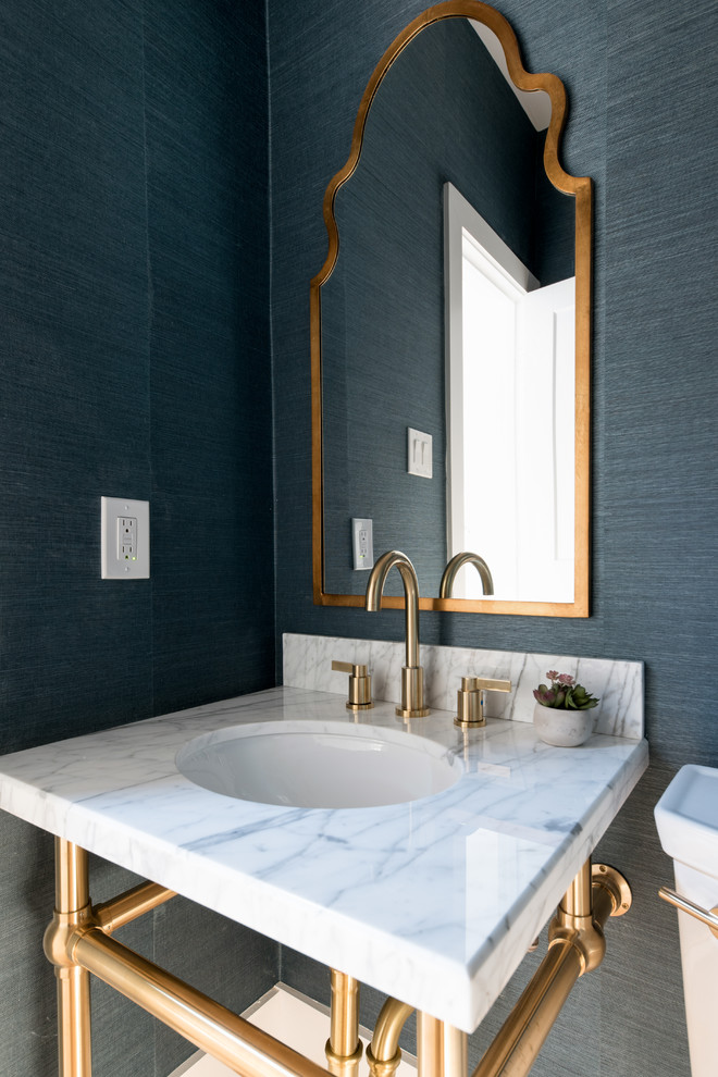 Inspiration for a small contemporary cloakroom in Dallas with open cabinets, green tiles, green walls, light hardwood flooring, a pedestal sink, marble worktops and white worktops.
