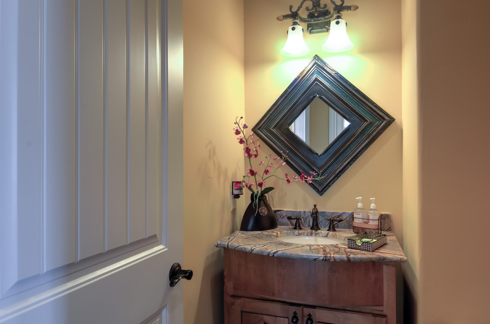 Example of a tuscan powder room design in Austin