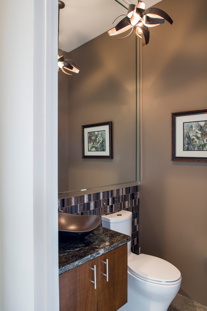 Contemporary cloakroom in Austin with a vessel sink, flat-panel cabinets, medium wood cabinets, granite worktops, mosaic tiles and brown walls.