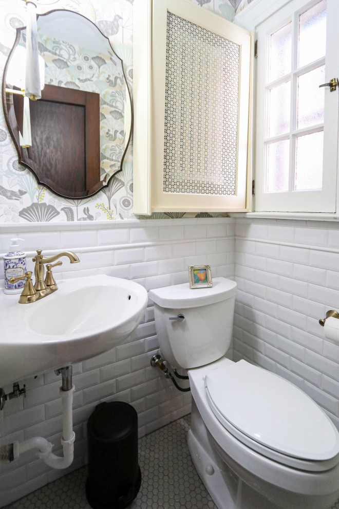 Design ideas for a small classic cloakroom in Cleveland with a two-piece toilet, white tiles, ceramic tiles, multi-coloured walls, ceramic flooring, a pedestal sink, grey floors and wallpapered walls.