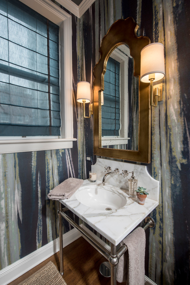 Photo of a small traditional cloakroom in Chicago with a console sink, marble worktops, brown floors and white worktops.