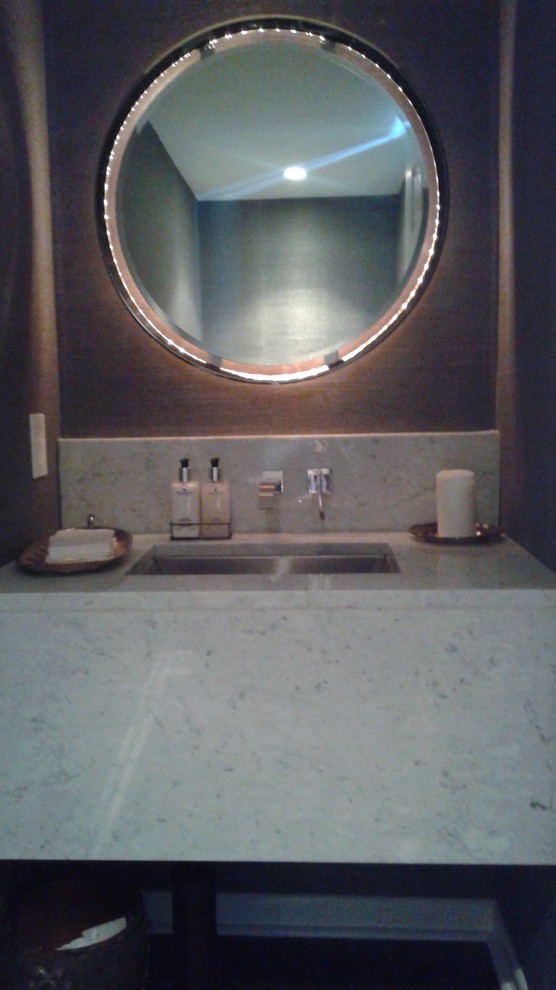 Photo of a small classic cloakroom in Denver with a submerged sink, marble worktops, a two-piece toilet, grey walls and dark hardwood flooring.